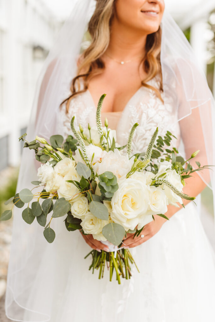 portrait of the bride holding her wedding bouquet