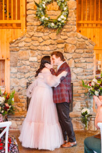 bride and groom kissing after their wedding ceremony
