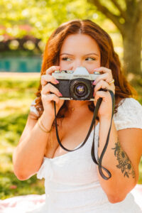 girl holding a film camera