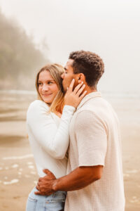 couple smiling at each other during their session