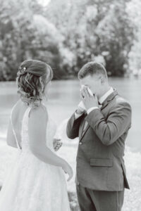 bride and groom emotional at their first look