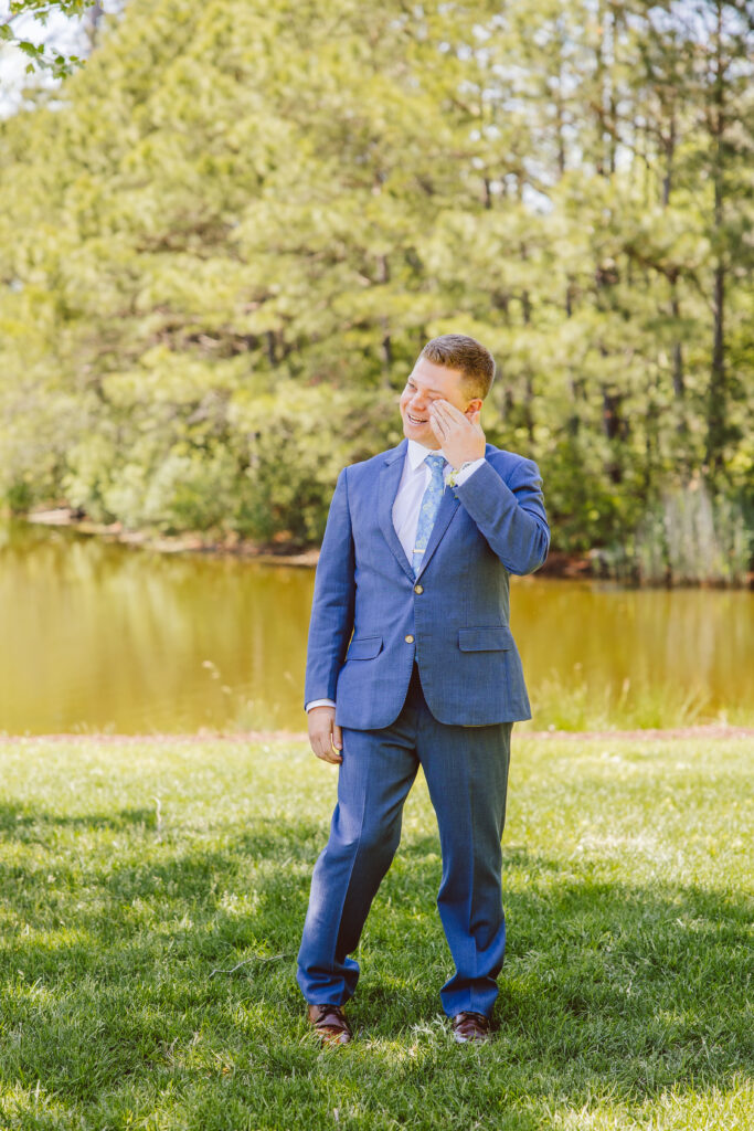 groom emotional during his first look