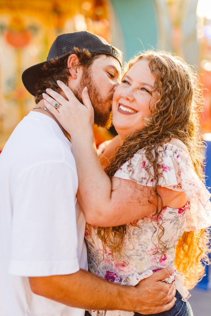 Fiancé, kissing his fiancé on the cheek