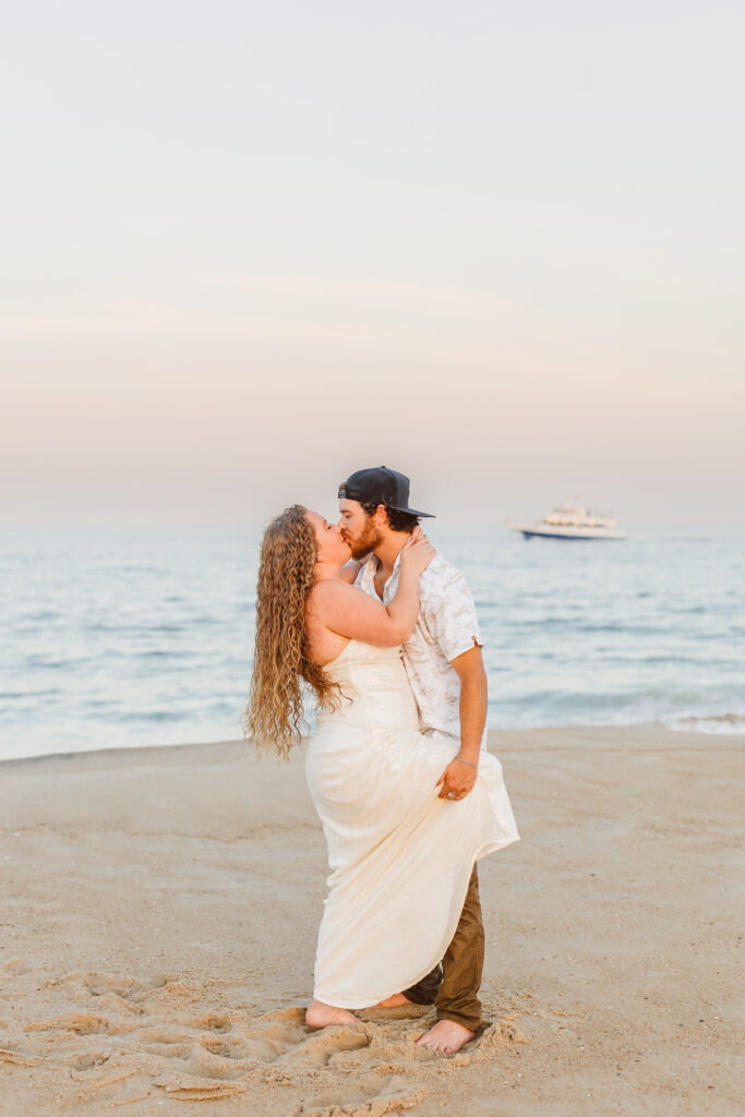 Cute picture of the newly engaged, couple kissing