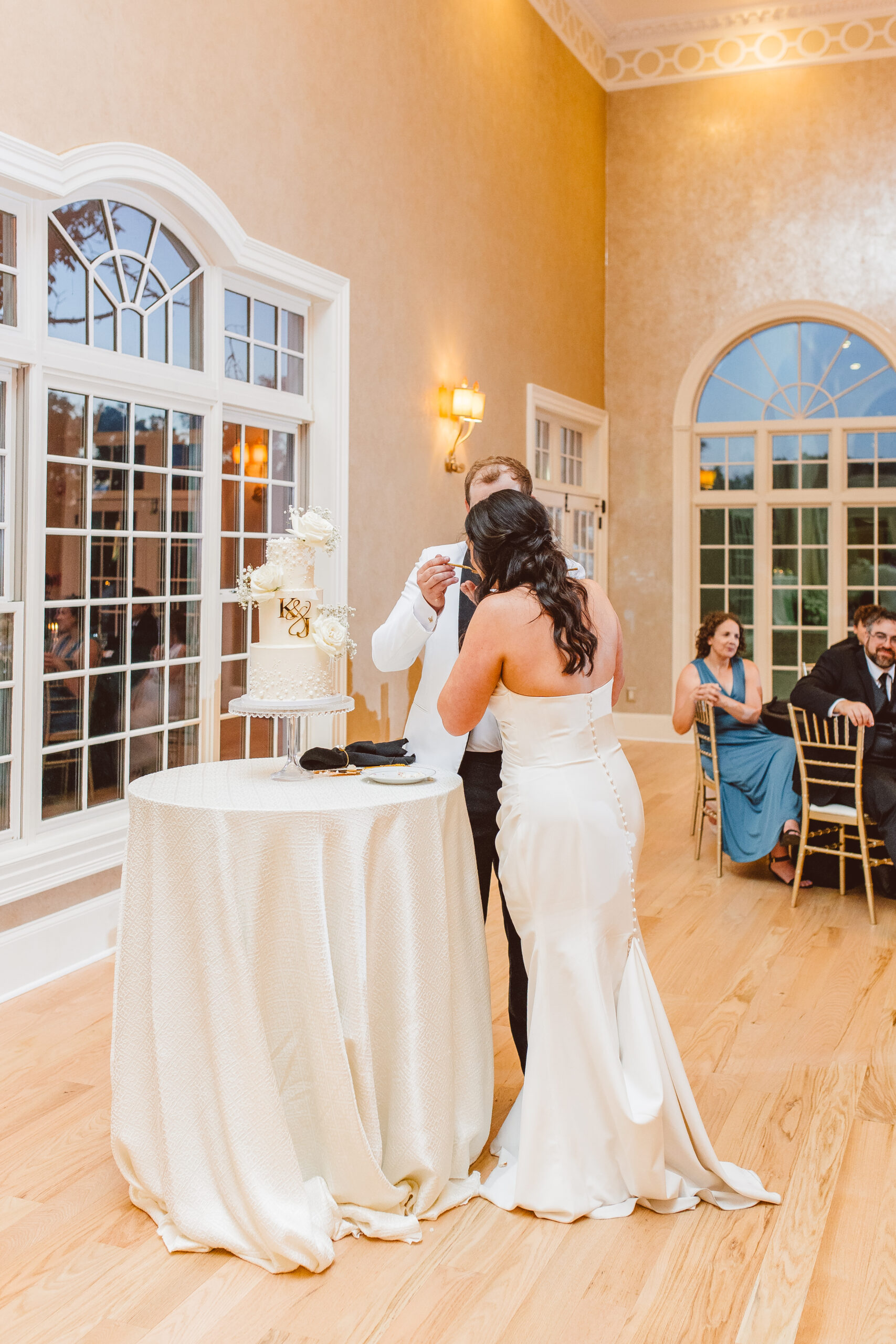 newlyweds cutting their wedding cake