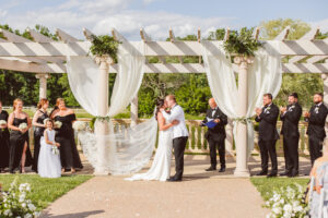 bride and groom kissing after the ceremony