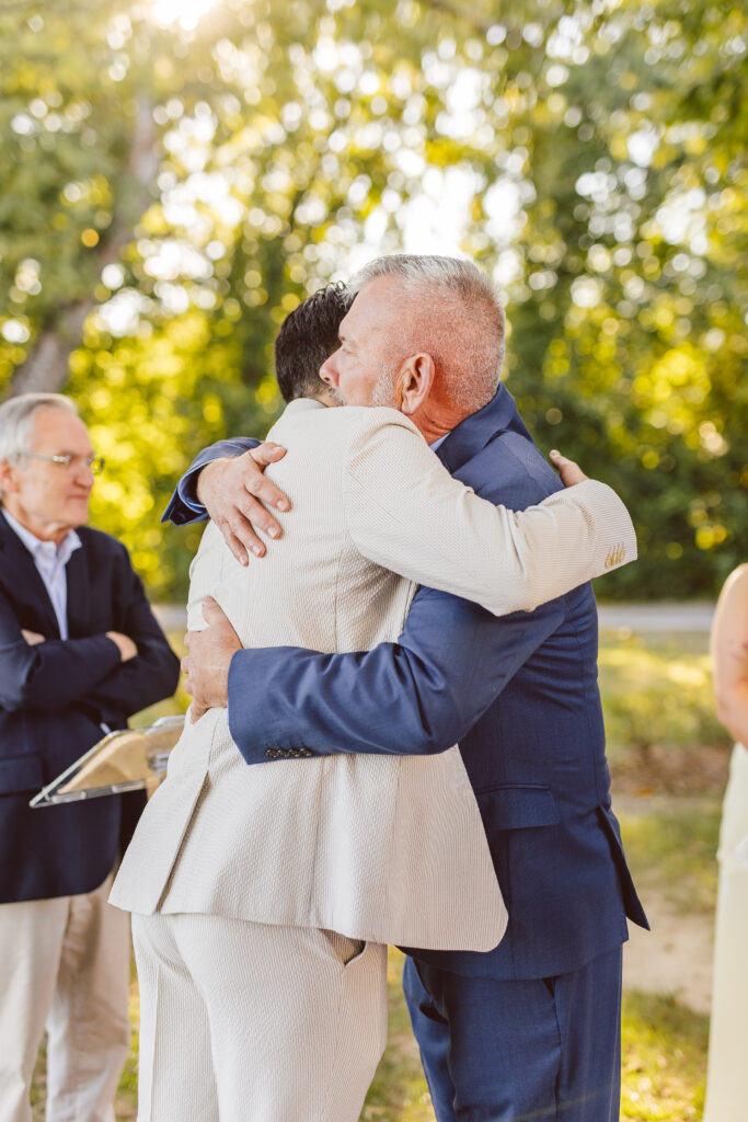 groom hugging his father in law