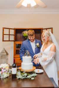 newlyweds cutting their wedding cake