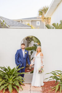 portrait of the newlyweds holding hands