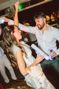 newlyweds dancing at their wedding reception party