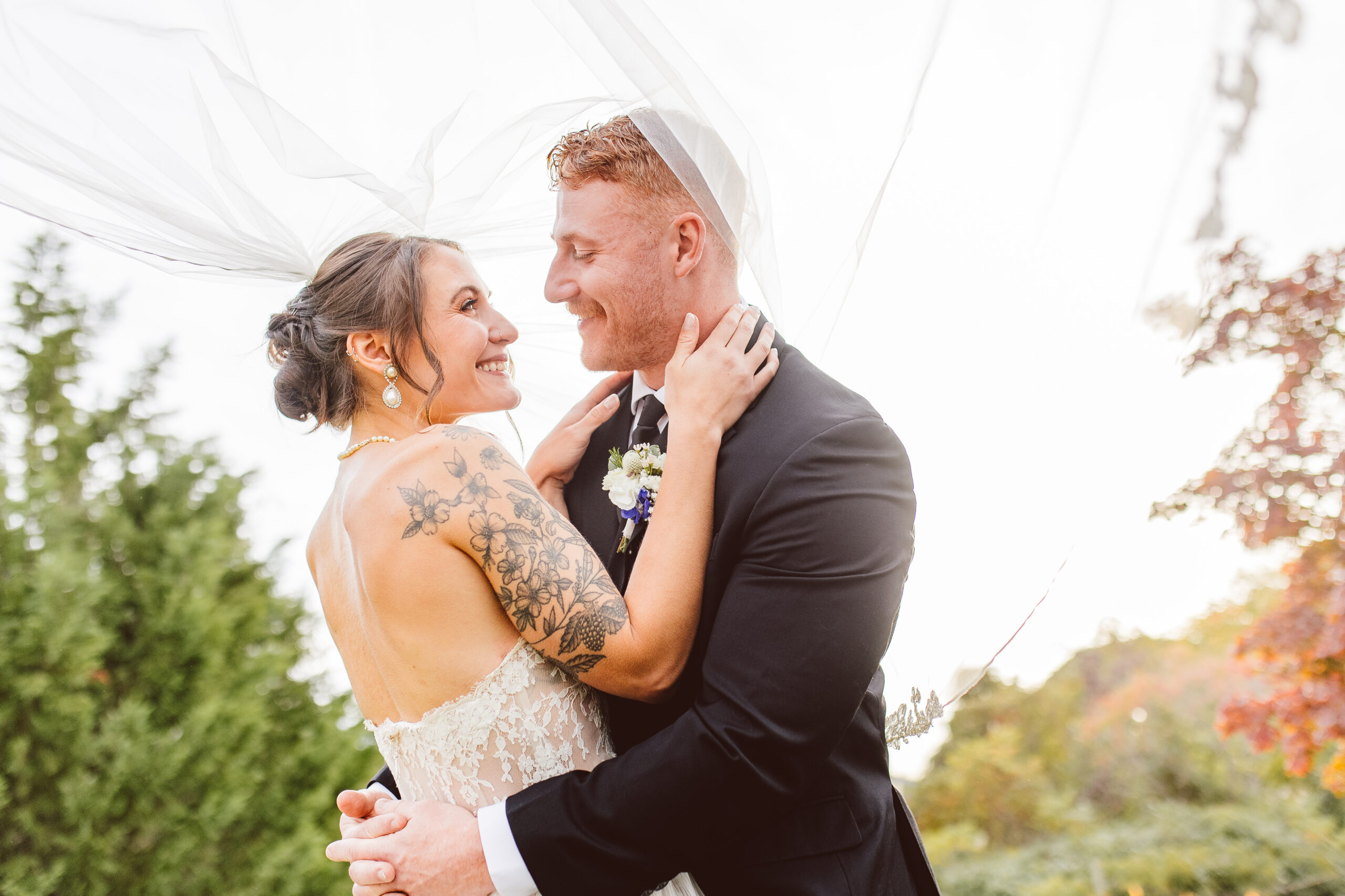 cute picture of the bride and groom smiling at each other