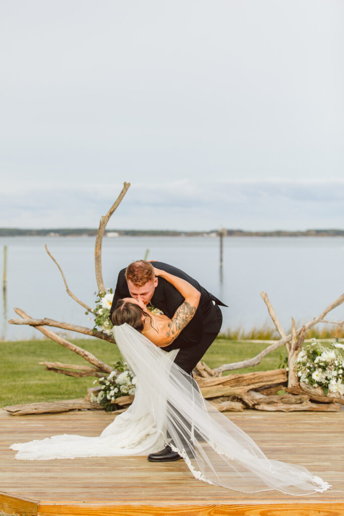 bride and groom kissing after their ceremony