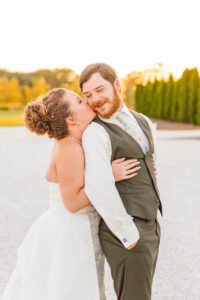 bride kissing the groom on the cheek