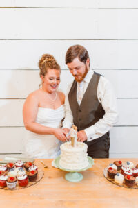 newlyweds cutting their wedding cake