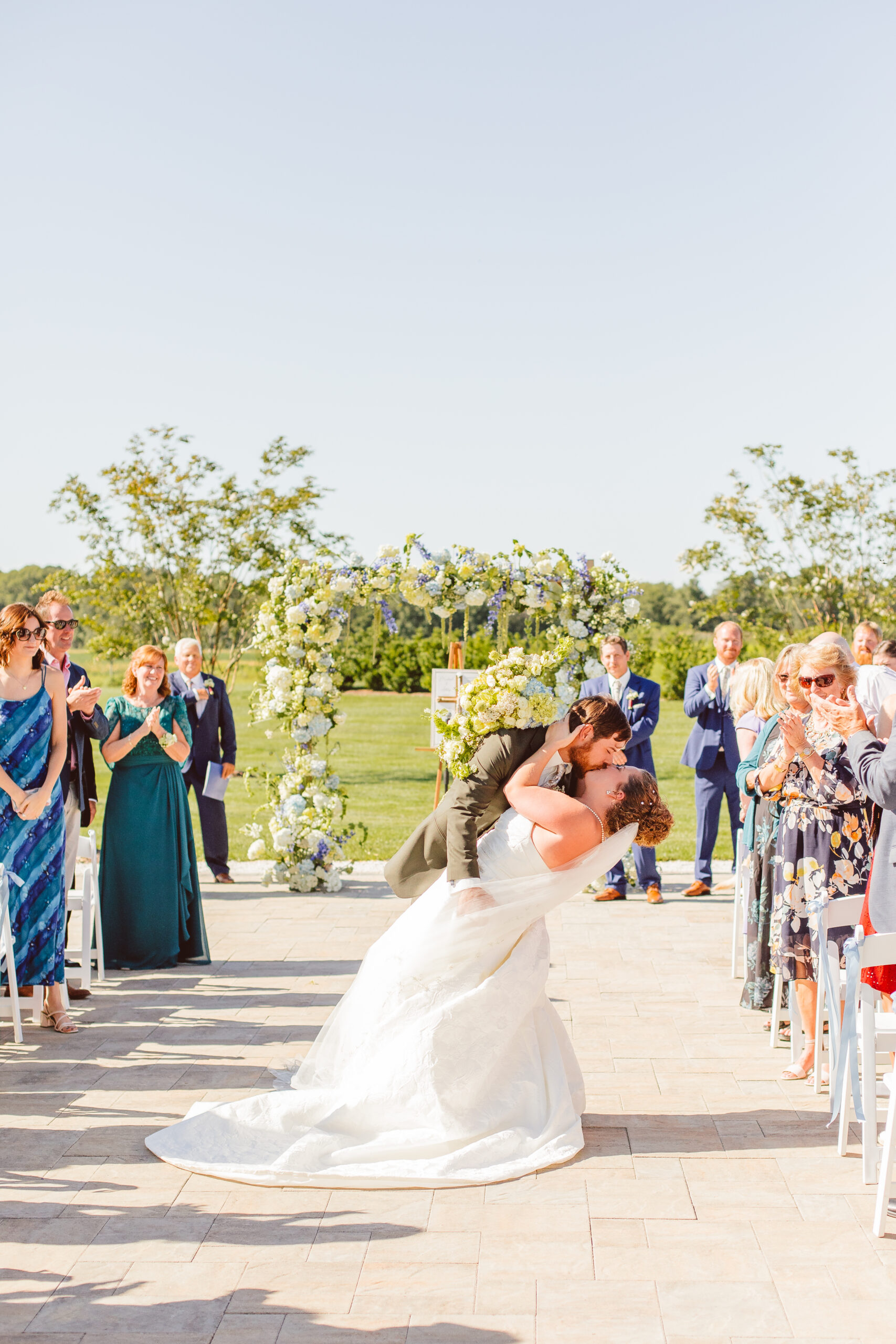cute portrait of the newlyweds kissing after the ceremony