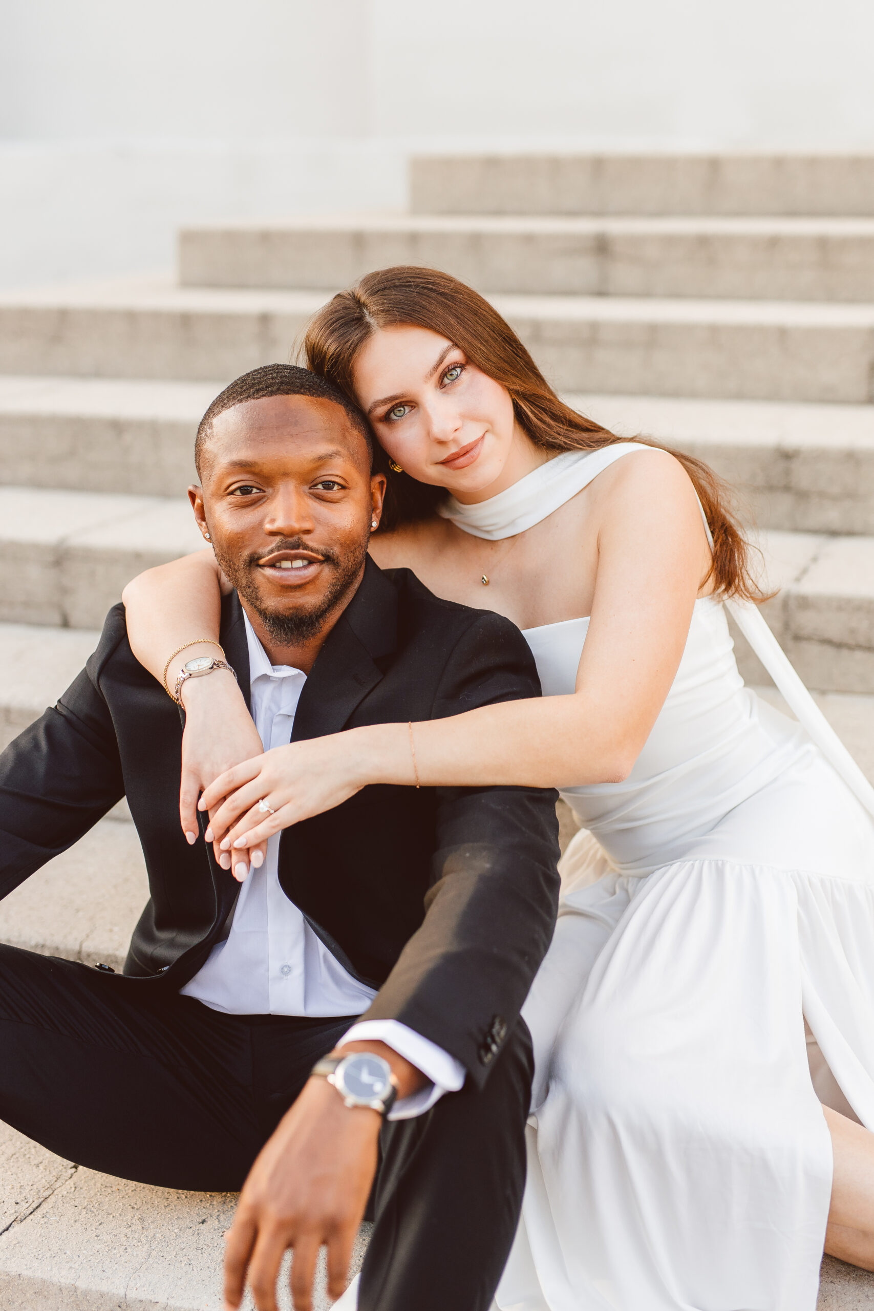 couple smiling at the camera during their photoshoot