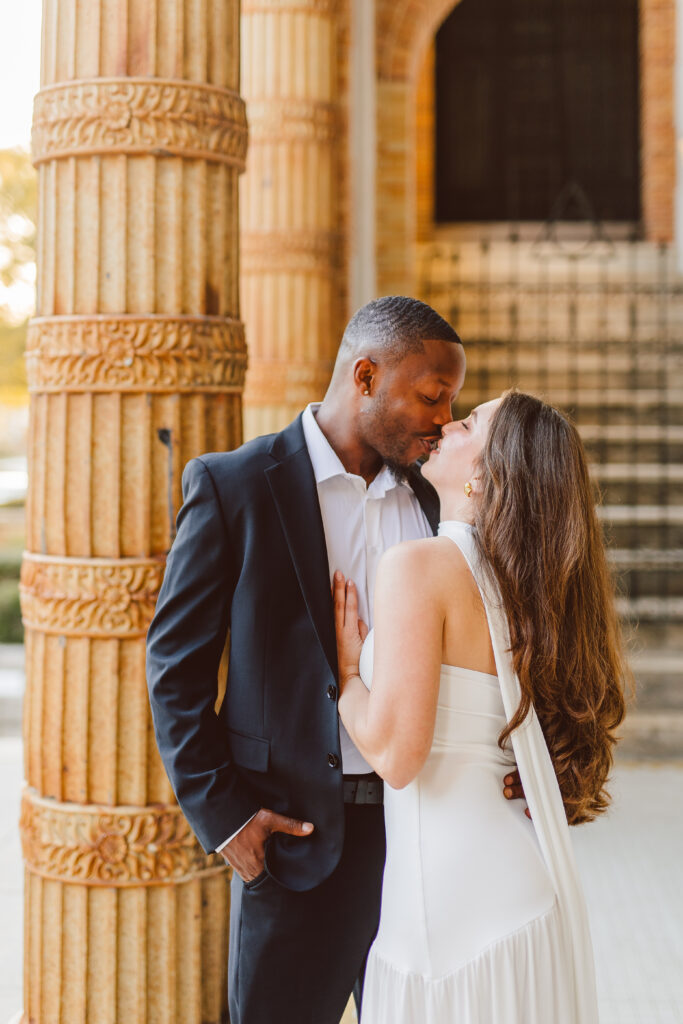 portrait of the newly engaged couple kissing
