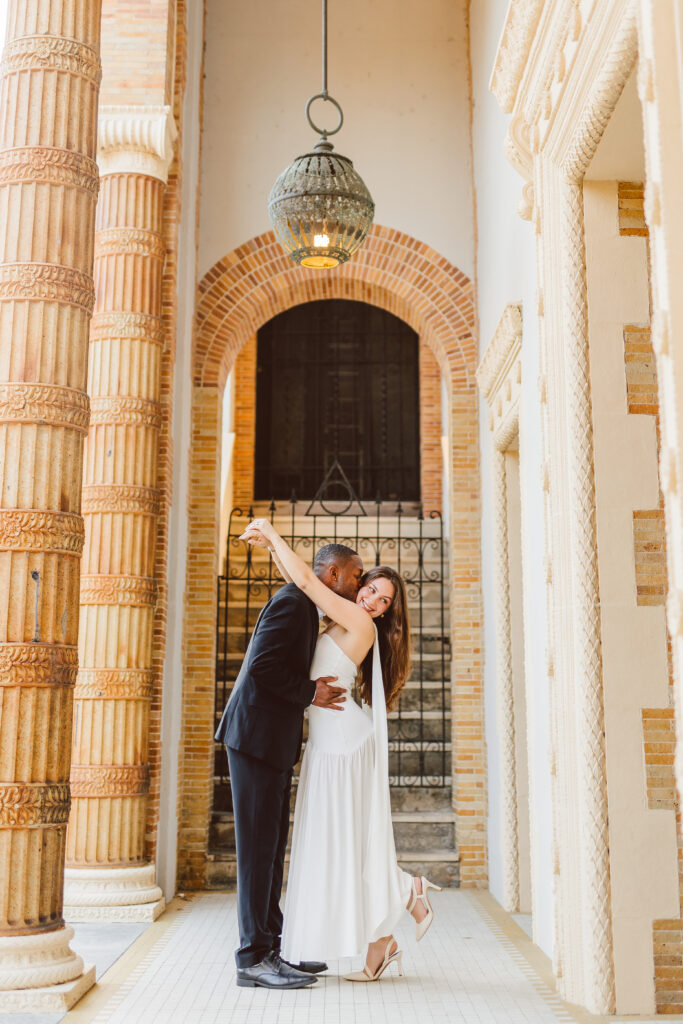 fiance kissing his fiance on the cheek