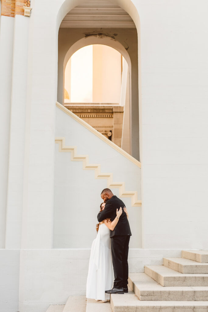 newly engaged couple hugging during their photoshoot