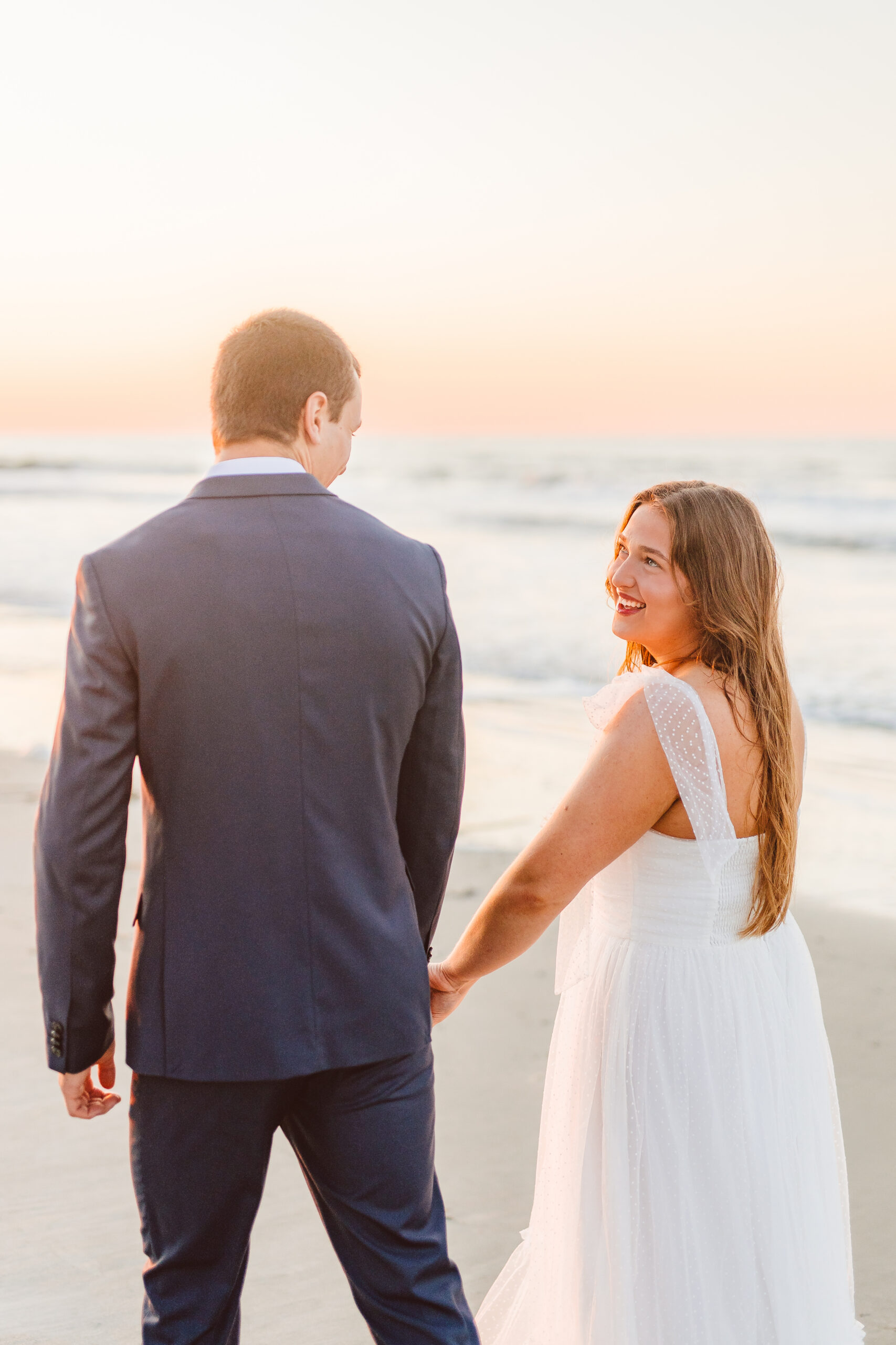 cute picture of the newly engaged couple smiling at each other