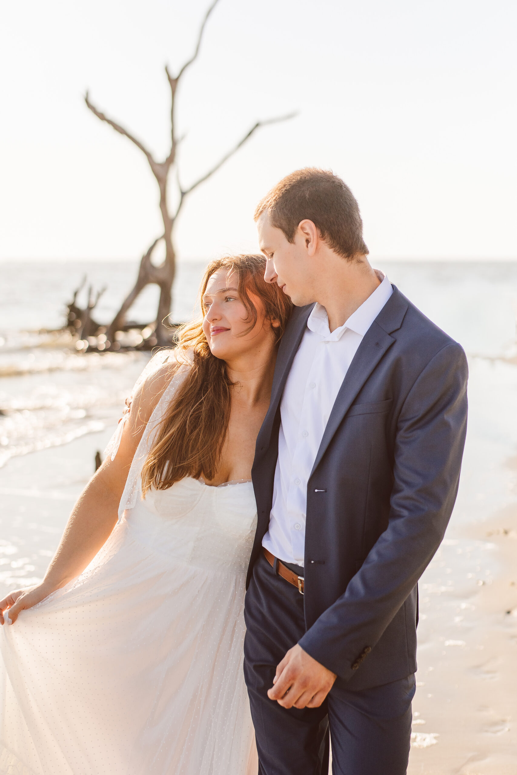 fiance kissing his fiance on the cheek