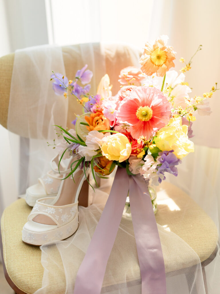 closeup shot of the wedding bouquet and wedding shoes