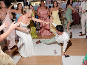 bride and groom having the best time at their wedding reception